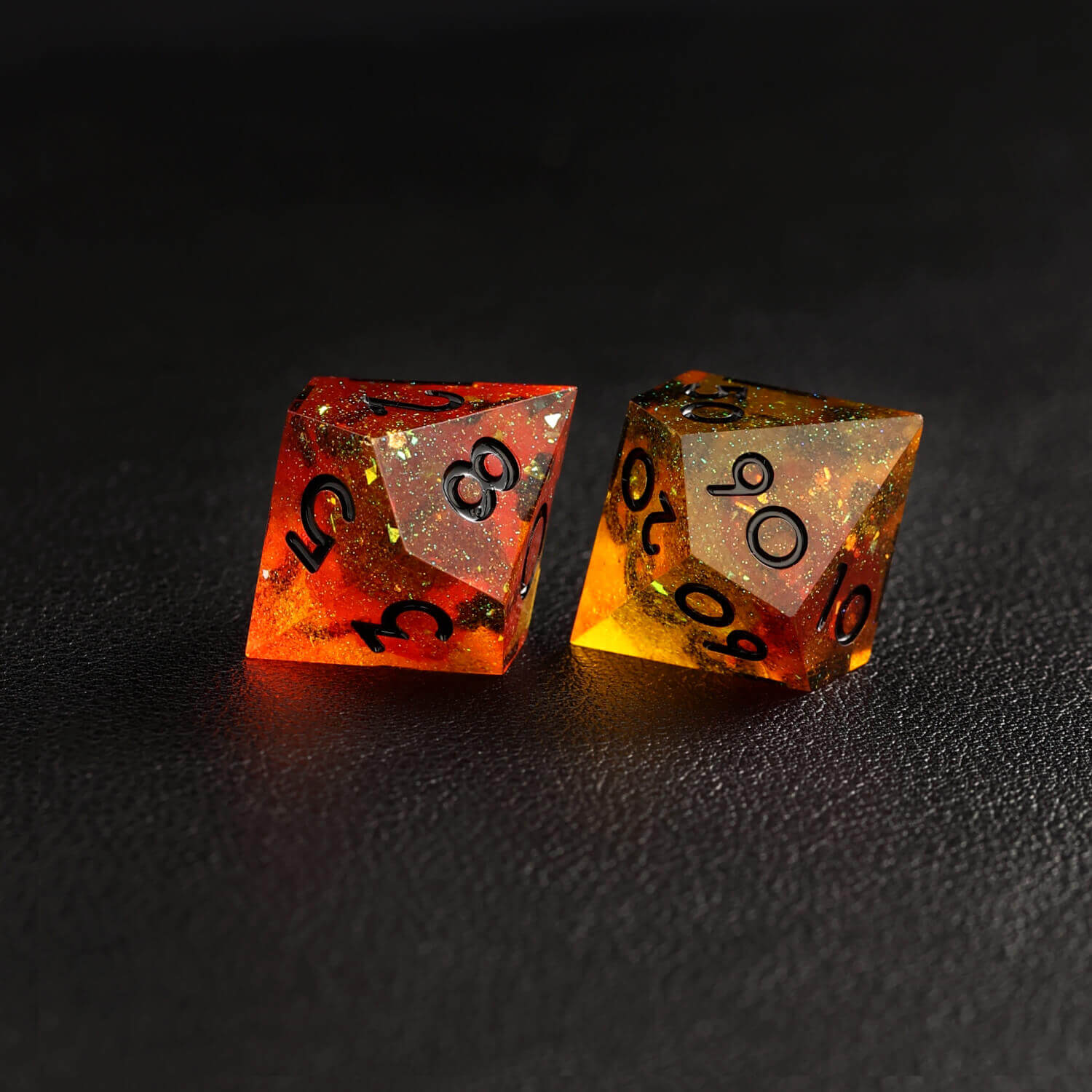 Close-up of sharp-edge orange red D10 dice with glowing gradient effect
