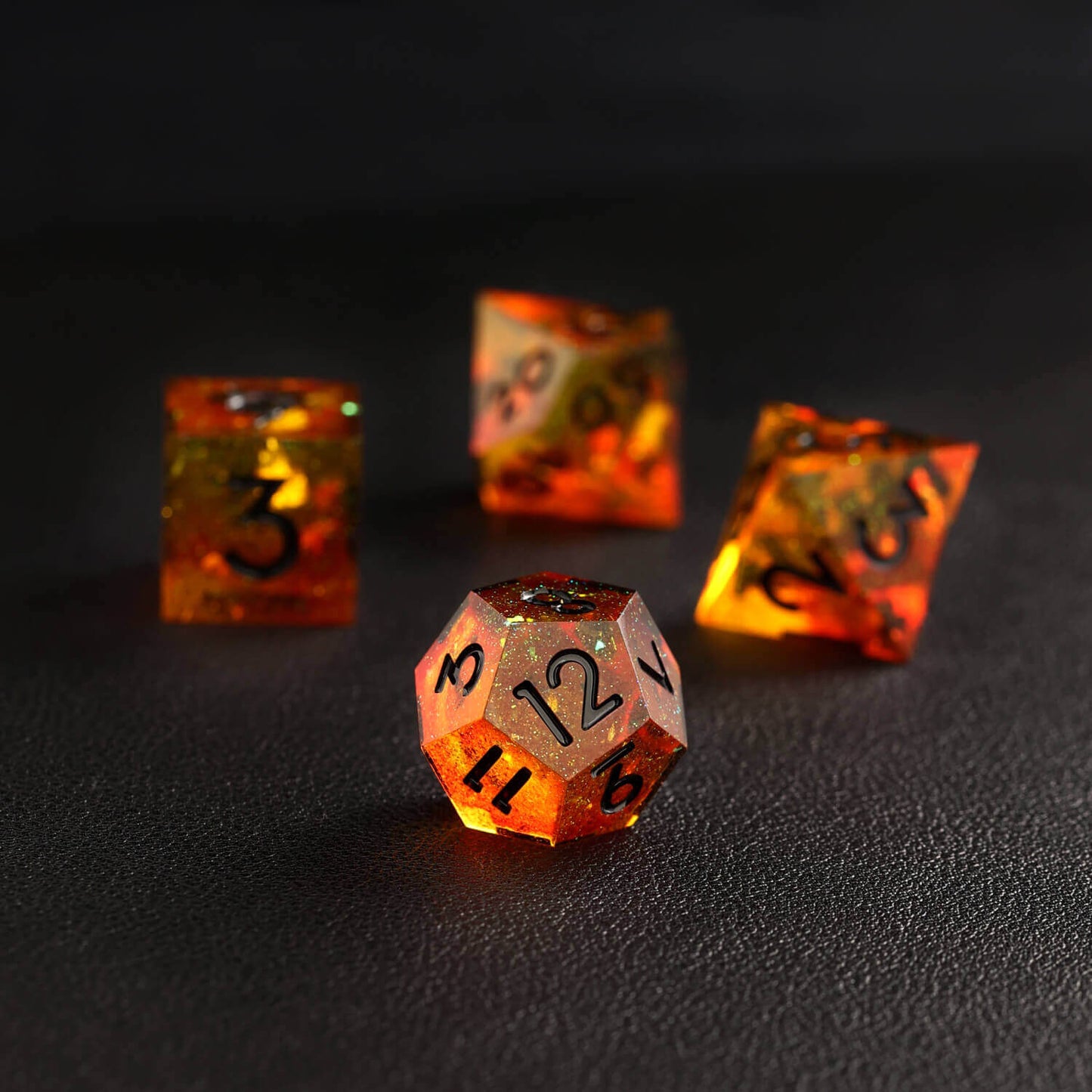 Focused shot of single orange red D12 dice with sharp edges and fiery hues
