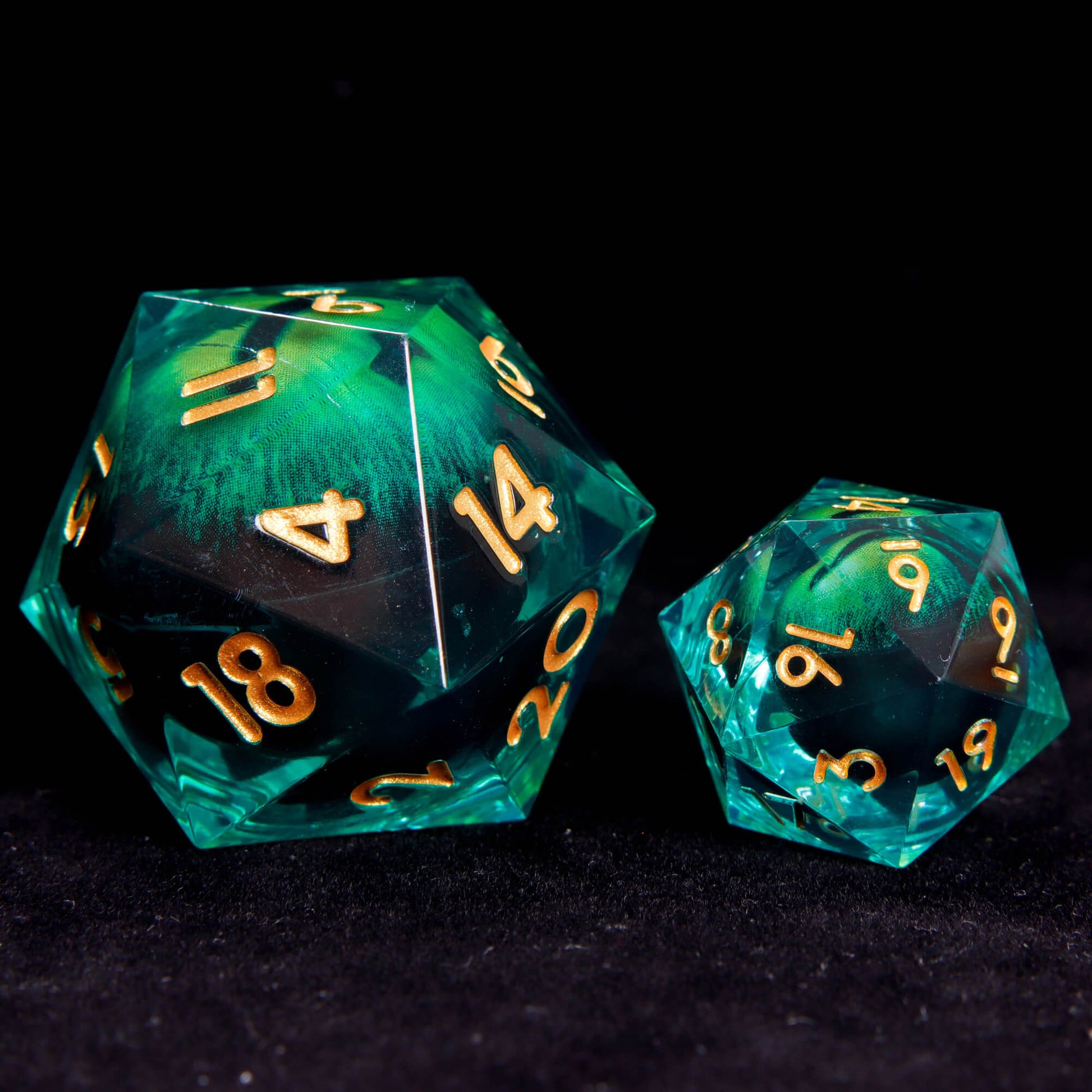 Oversized Demon Eye D20 side-by-side with standard D20, showing size comparison and glowing demon eye core