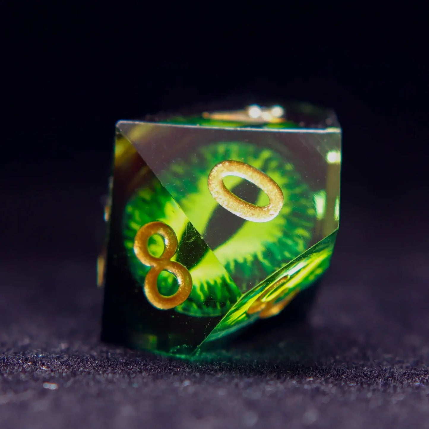 Two Green Resin percentile D10 dice (00-90 and 0-9) from the Demon's Eye set.