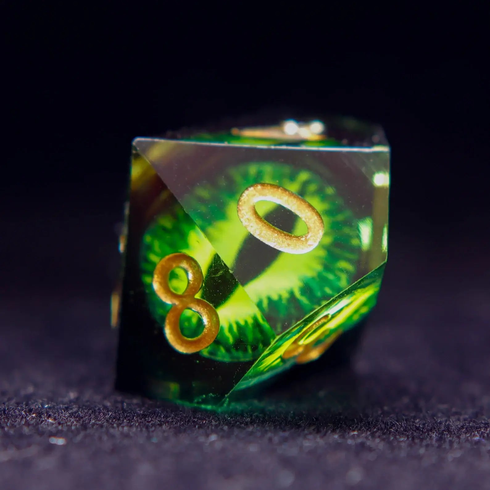 Two Green Resin percentile D10 dice (00-90 and 0-9) from the Demon's Eye set.