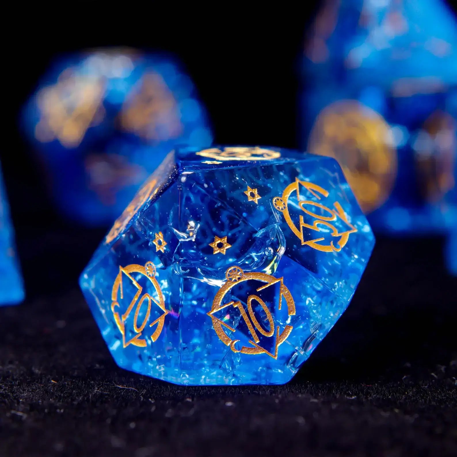 The percentile die (D00) from the set. A beautiful piece of sharp edge dice with a starry core, essential for DND dice rolls.