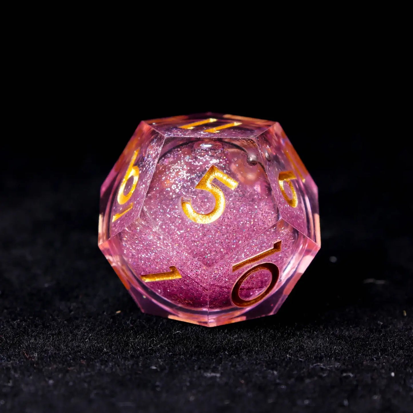 Multiple angles of pink liquid dice showing the dreamy interplay of pink and purple light refraction.