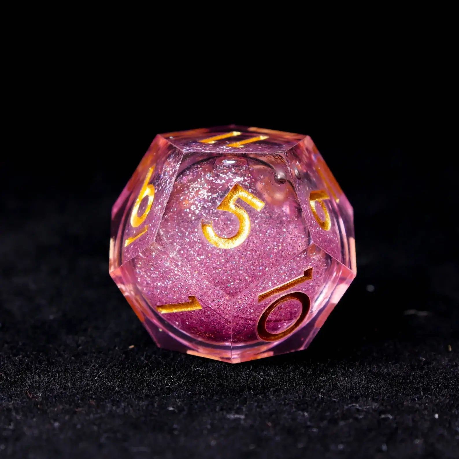 Multiple angles of pink liquid dice showing the dreamy interplay of pink and purple light refraction.
