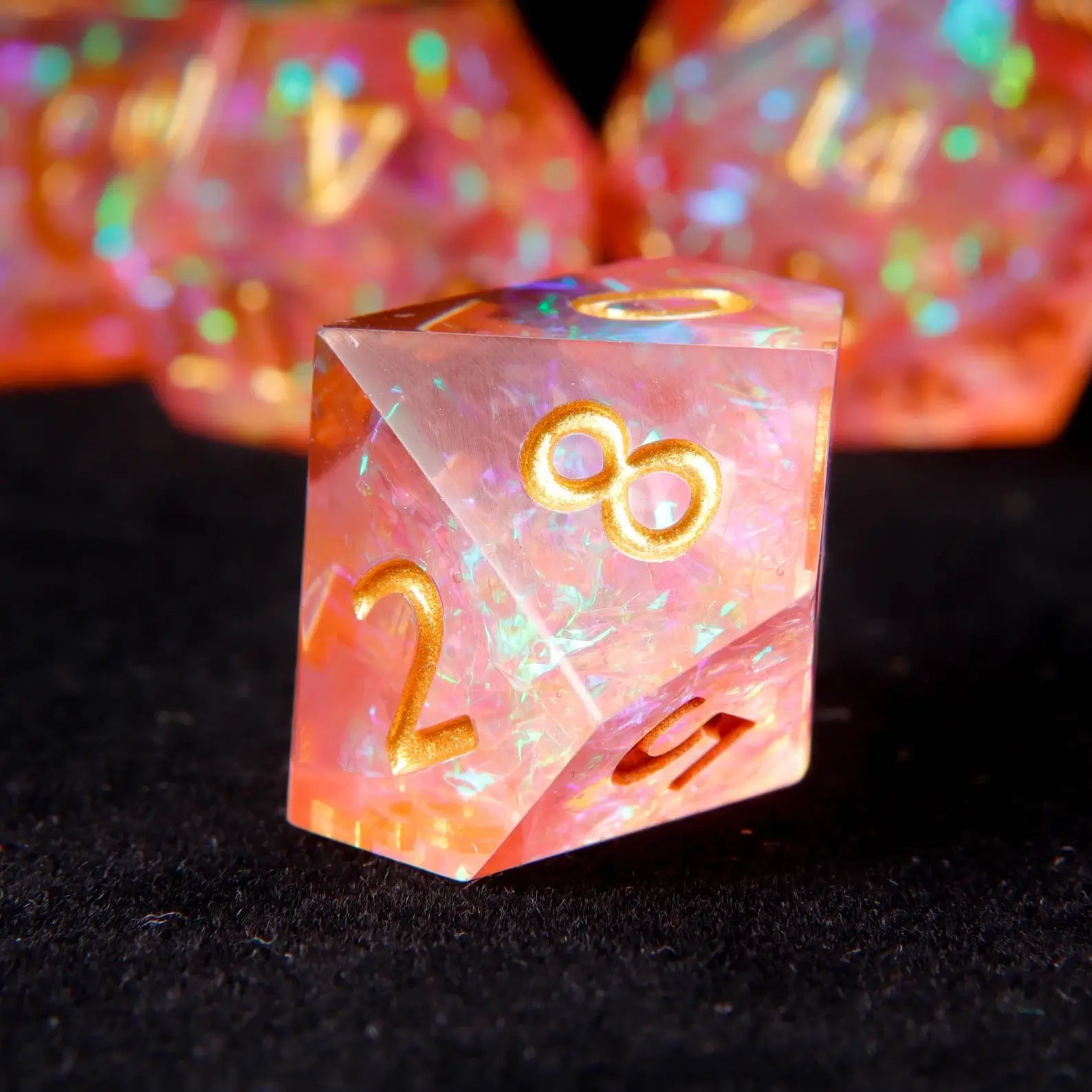 Professional DND player dice set in holographic sunset orange and coral pink