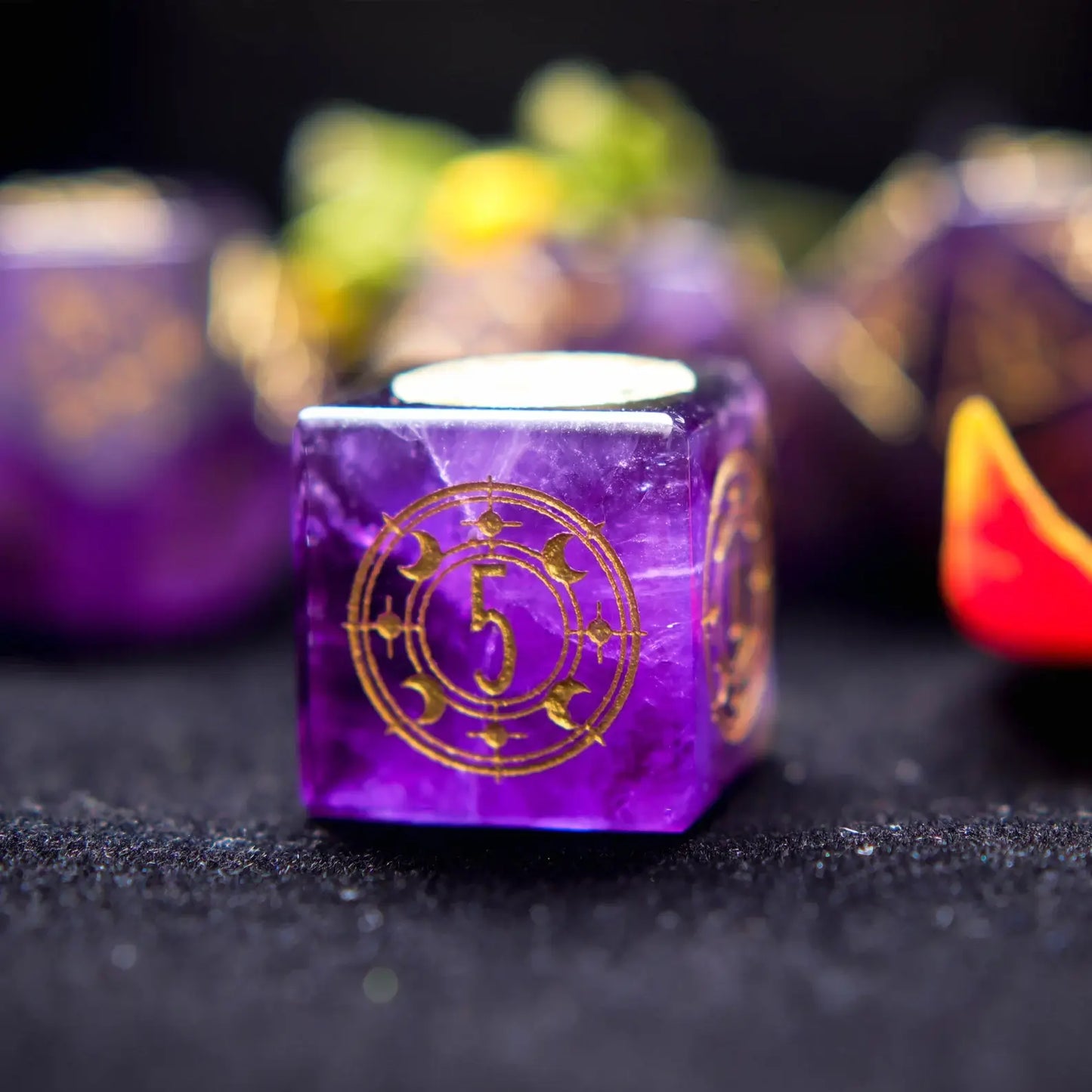 Lighting shot of the Purple Crystal DND Dice Set emphasizing the deep purple hue and light-reflective luster of the Amethyst.