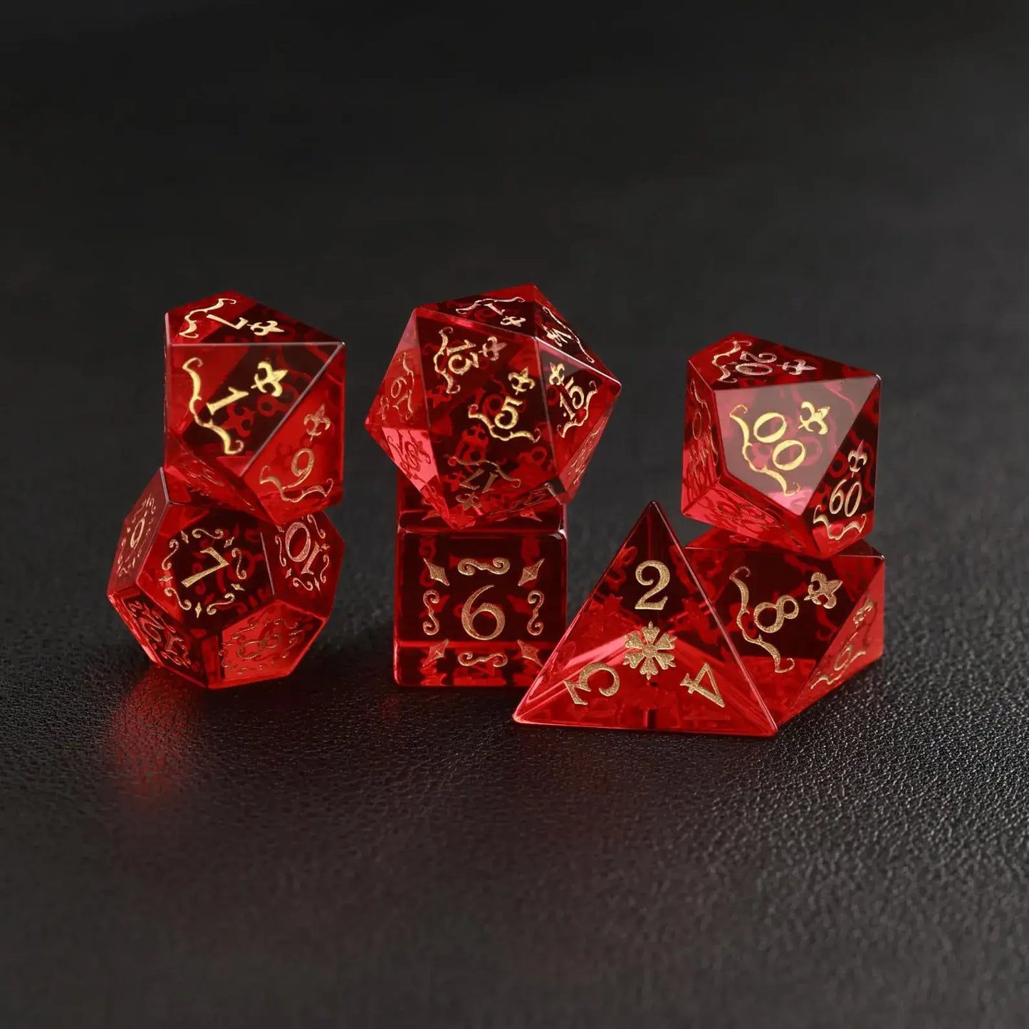 Close-up showing the smooth, perfectly balanced surface of the Red Garnet DND Dice on a dark surface.