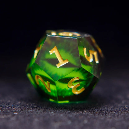 Single Green Resin D12 die with hand-painted Demon's Eye and engraved numbers.
