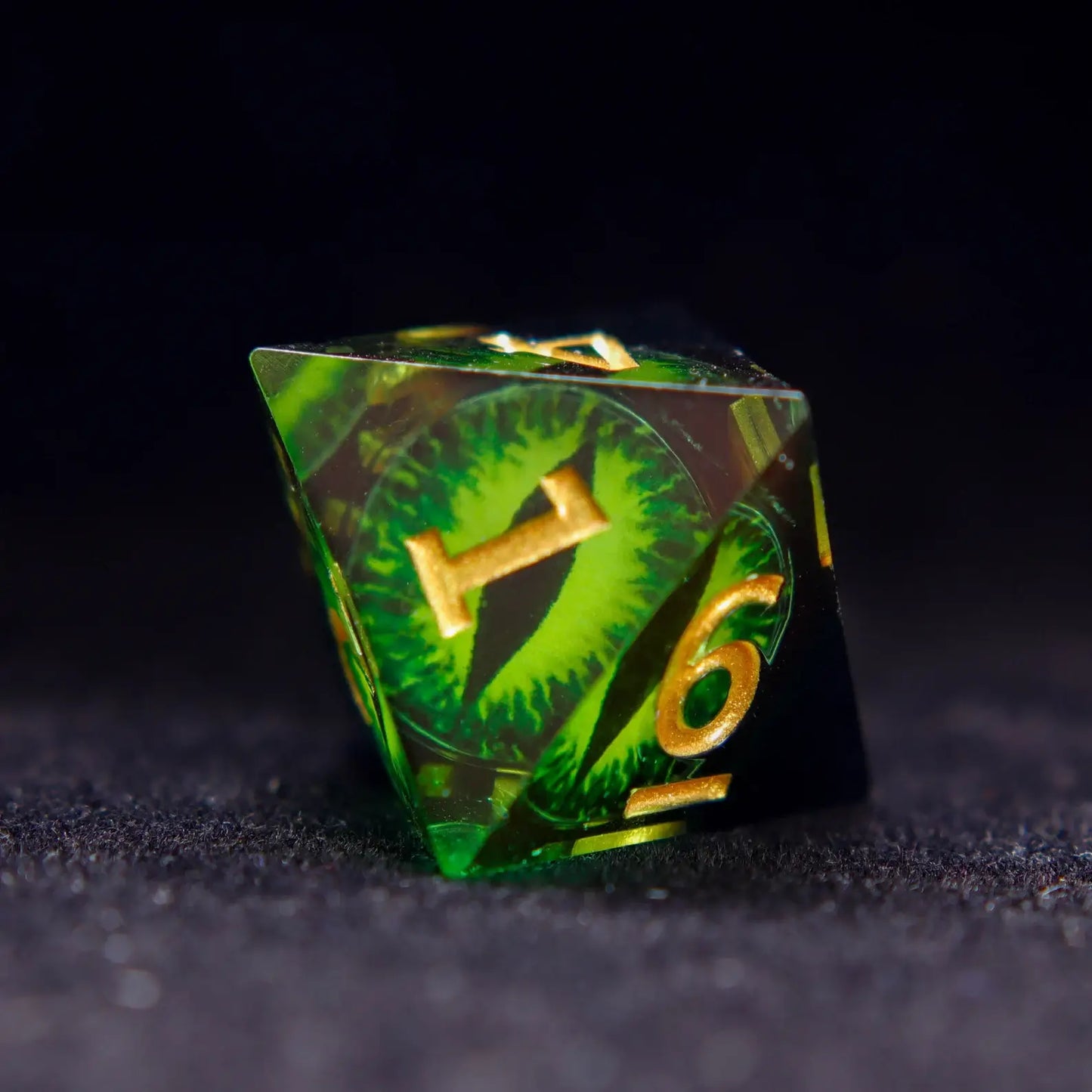Single Green Resin D8 die showing the Demon's Eye design on multiple facets.