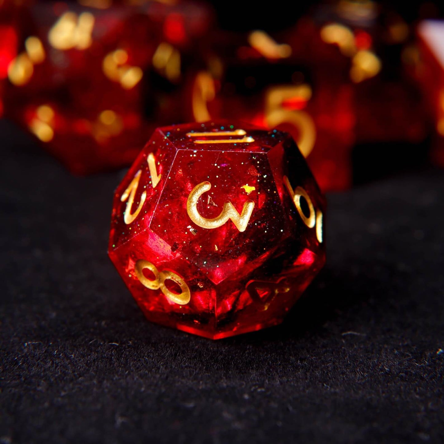 High-clarity view of the fixed fiery red pigment swirls inside a solid resin polyhedral die.