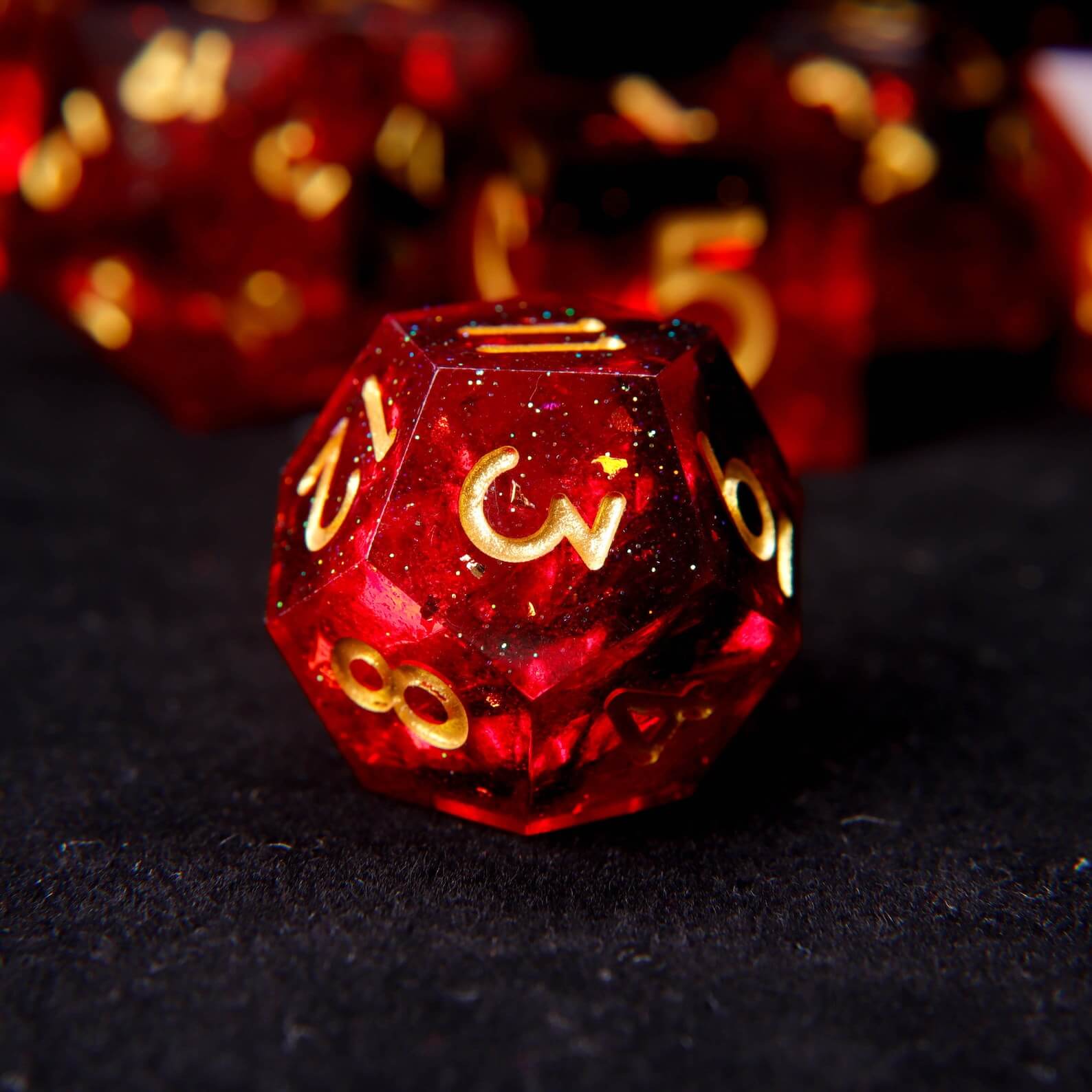 High-clarity view of the fixed fiery red pigment swirls inside a solid resin polyhedral die.
