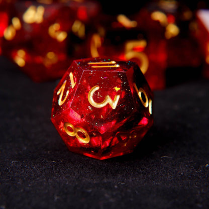 High-clarity view of the fixed fiery red pigment swirls inside a solid resin polyhedral die.