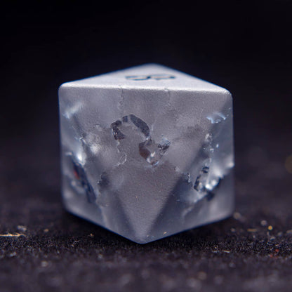 Detailed shot of the D8, showcasing the custom lightning-bolt numeral design on this unique gemstone dice.