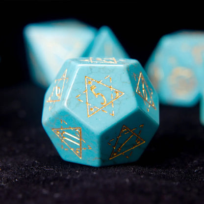 Single Green Howlite D12 die with intricate engraved symbols.