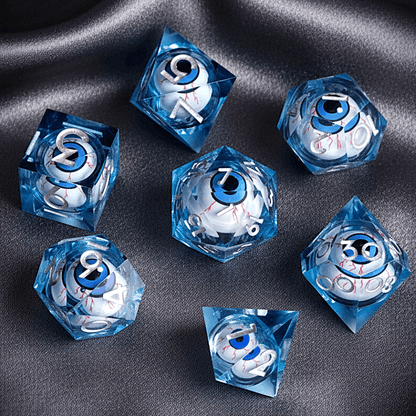Complete set of seven blue URdice Moving Eyes D&D dice. Features a cool-toned blue resin body with glowing eyes suspended in the liquid core.