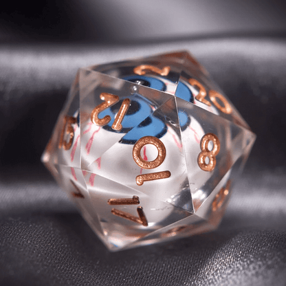 Close-up of a white D20 die from the Moving Eyes set. A mysterious eye floats within its glowing green liquid core.