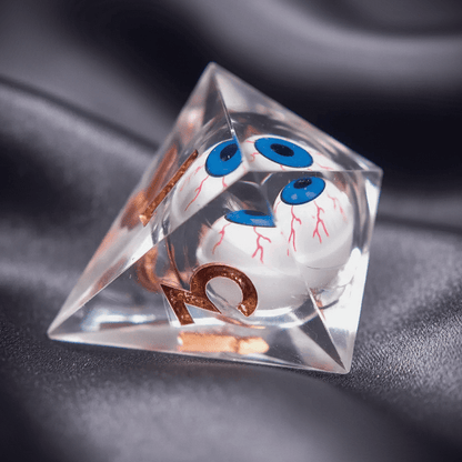 White D8 polyhedral die with a hypnotic liquid core. A detailed eye appears to gaze out from within the die.
