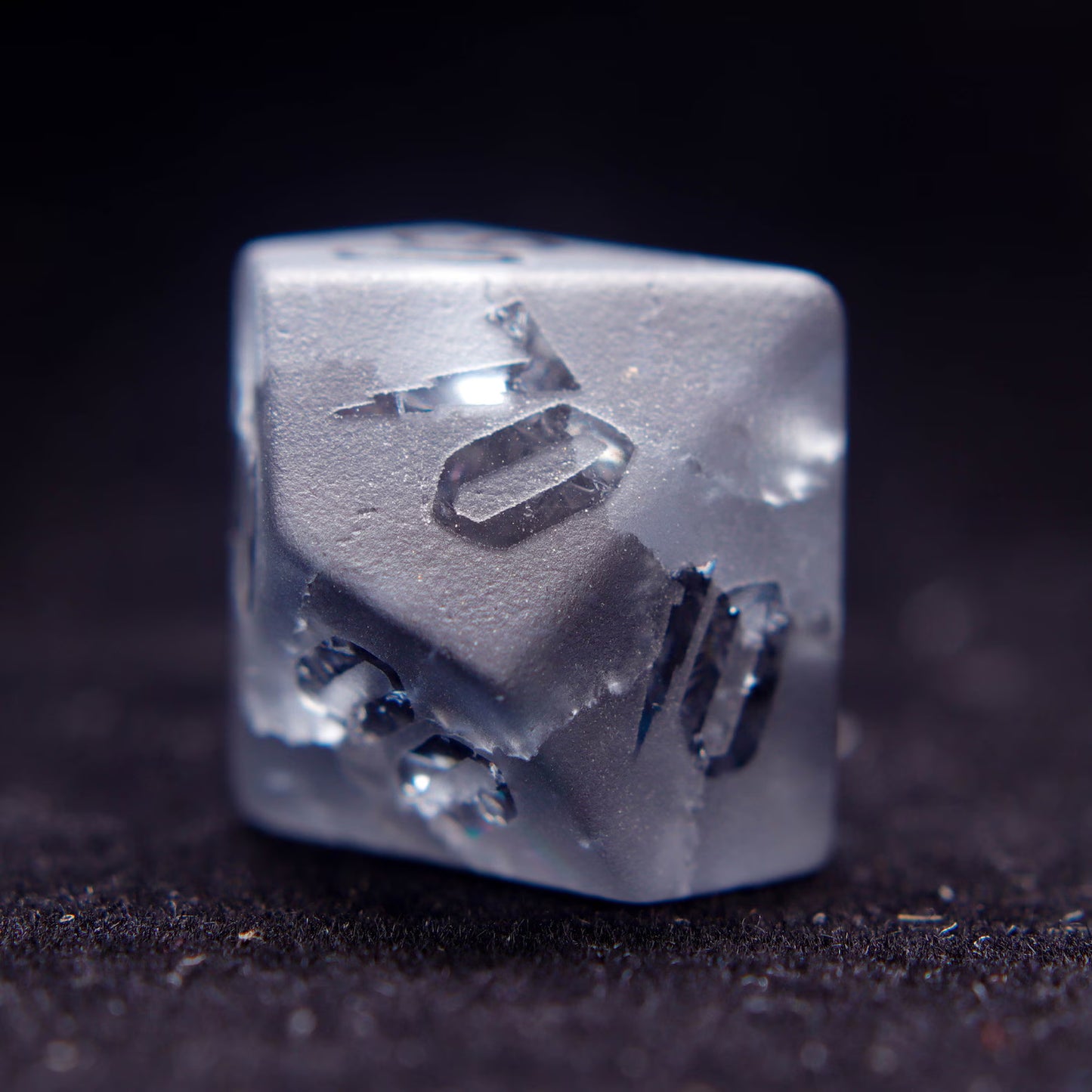 The percentile D% gemstone dice, poised for a dnd dice roll, highlighting the unique matte finish and numbers.