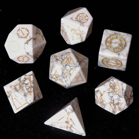 Complete URDICE White Howlite Gemstone Engraved Dice Set arranged on grey velvet