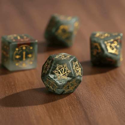 Close-up view of a D20 and D12 from the Gemstone Engraved Dice Set on a warm walnut table, with soft focused background