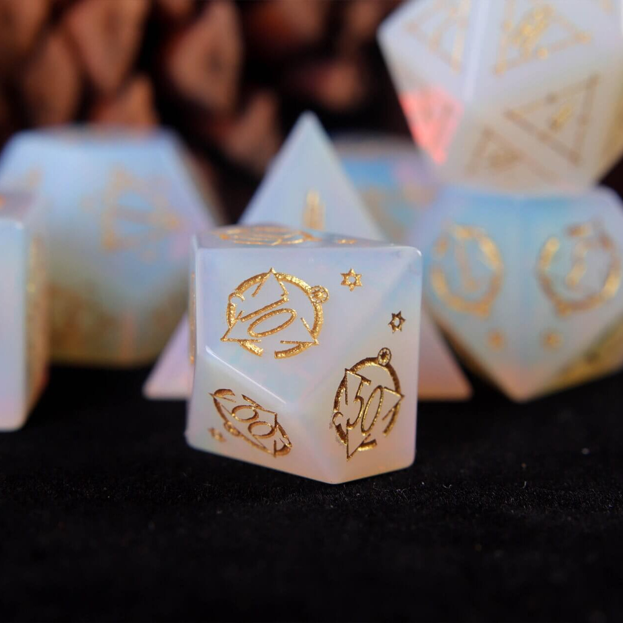 White carved opal percentile die with smooth polished finish and subtle opal glow.