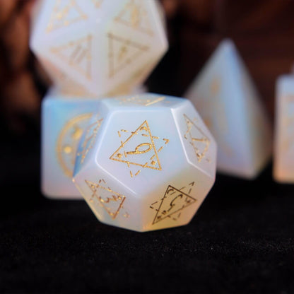 White opal D12 with translucent body and precision-etched geometric patterns.
